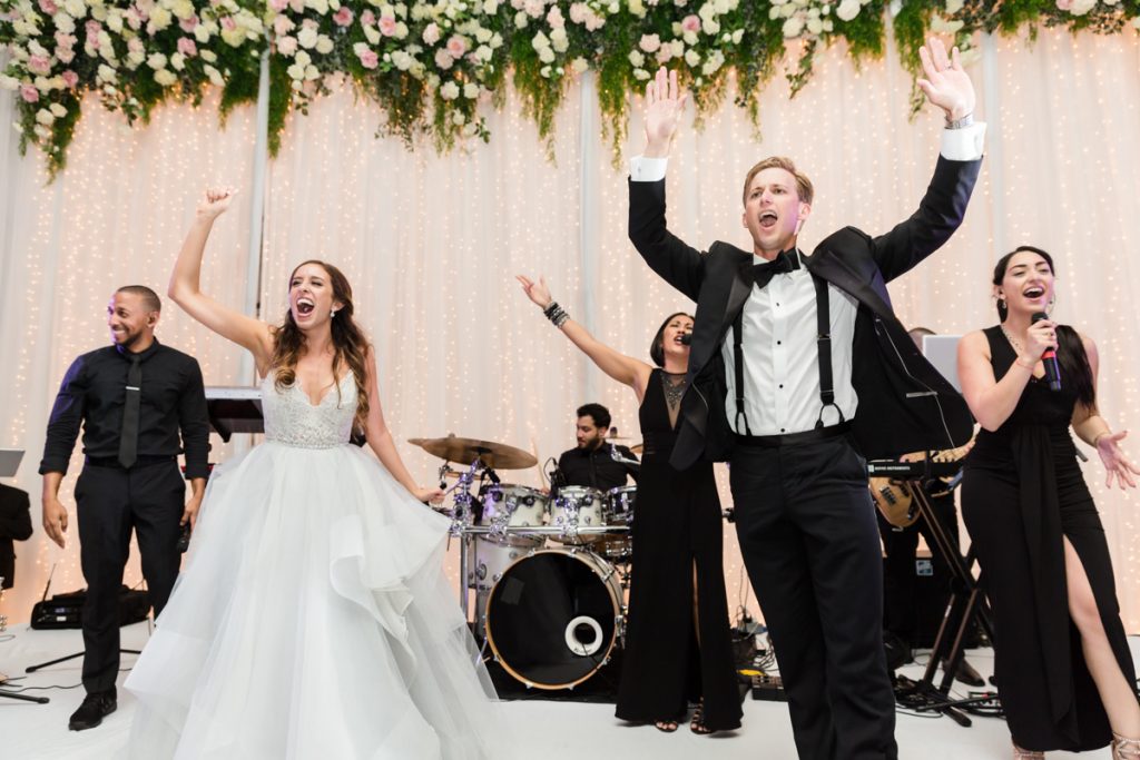 Bride and groom dance on stage at the Mandarin Oriental on Brickell Key