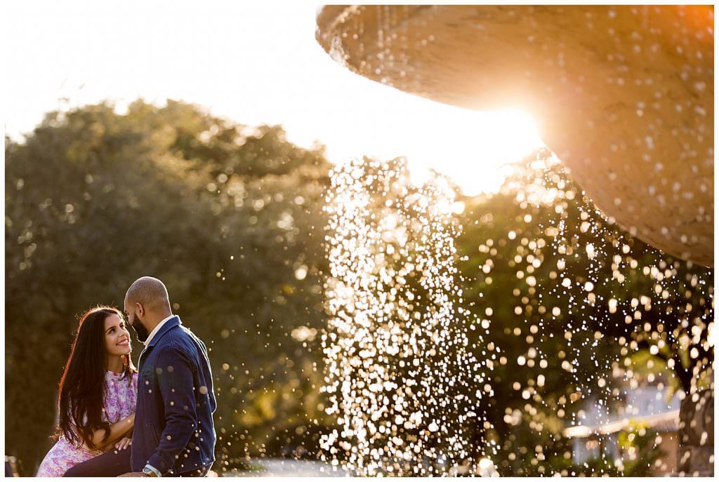 Bride and groom at De Soto Fountain during their engagement session in Coral Gables.
