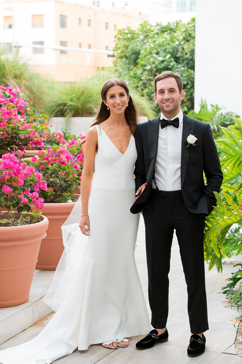 Bride and groom laughing in the lobby of the Edition on Miami Beach