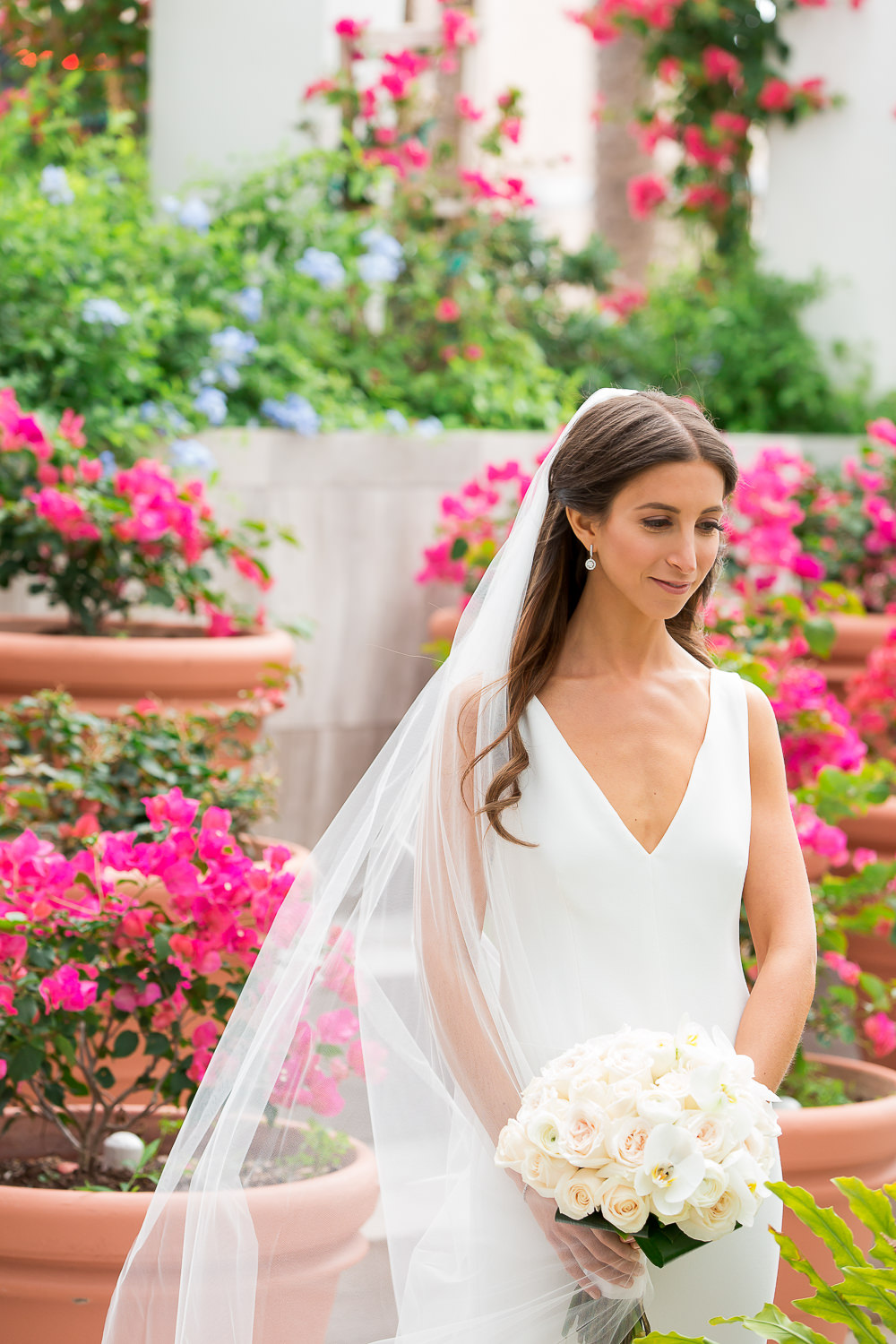 Bride with a bouquet of orchids at the Miami Beach Edition.