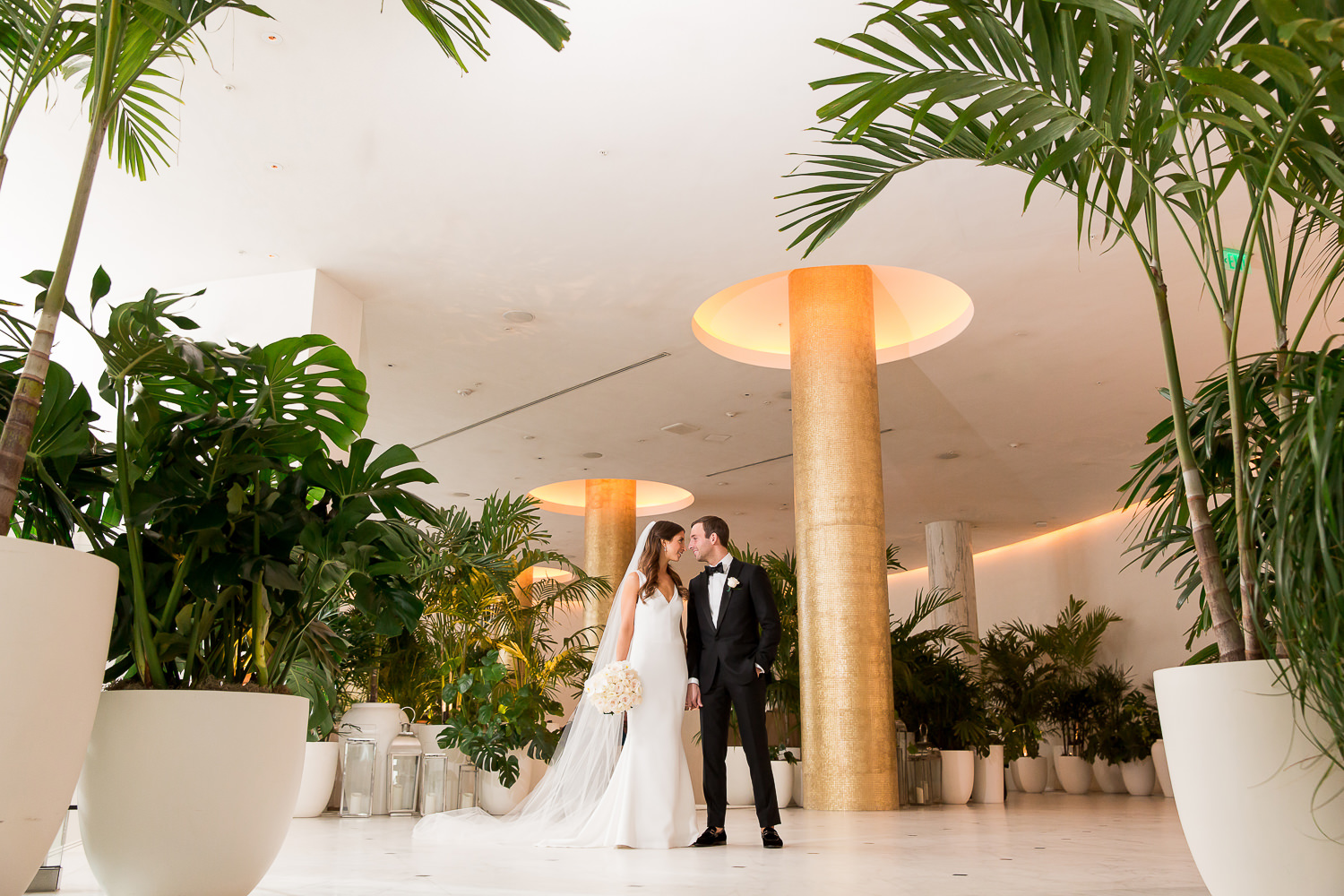 A couple posing in the lobby at the Edition on Miami Beach.