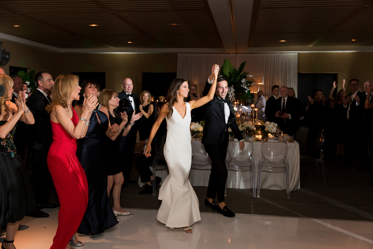 Bride and groom walk into the ballroom hand in hand at the Miami Beach Edition.
