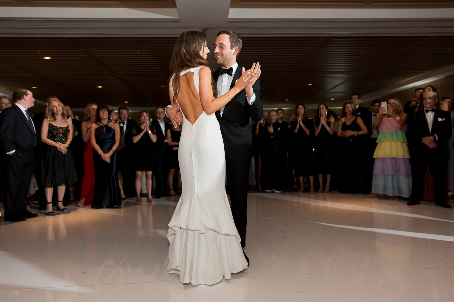 Bride and groom smiling during their first dance at the Miami Beach Edition.