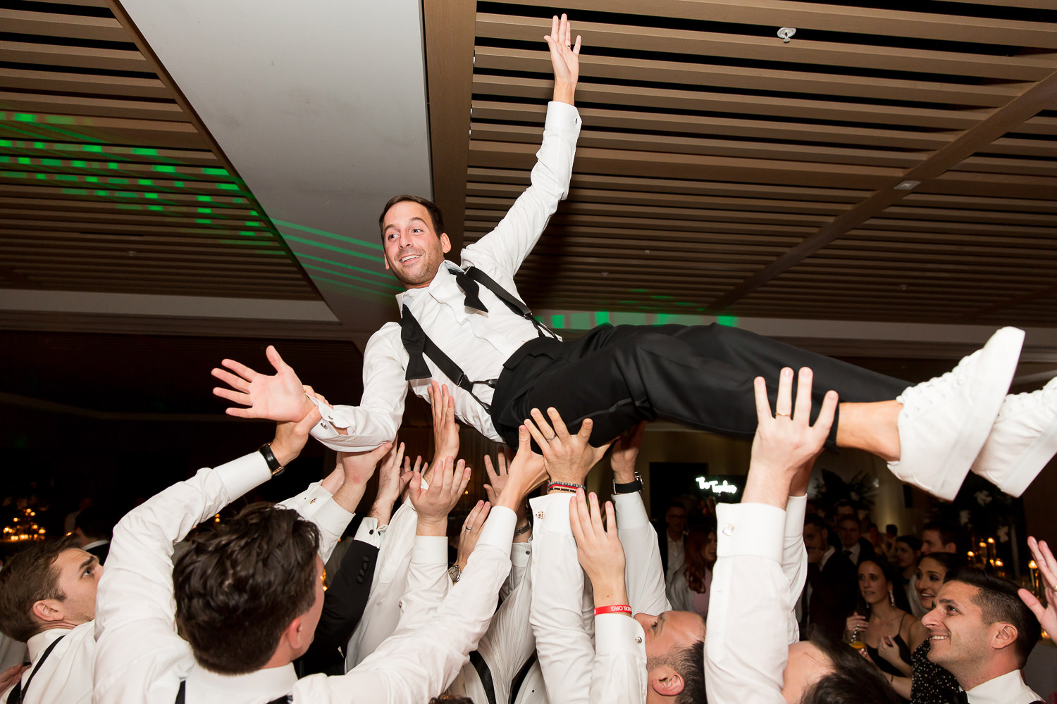 Groom crowd surfing at the Miami Beach Edition.