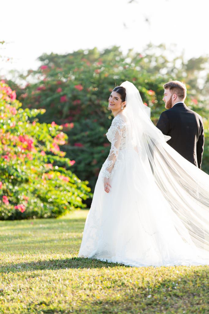 Bridal party takes portraits during their elegant tented backyard wedding in Palm Beach.