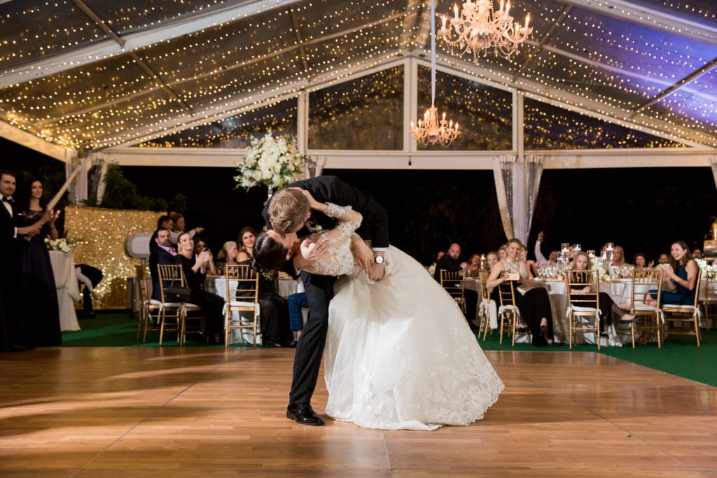 Bride and groom dance in during their tented Palm Beach wedding.