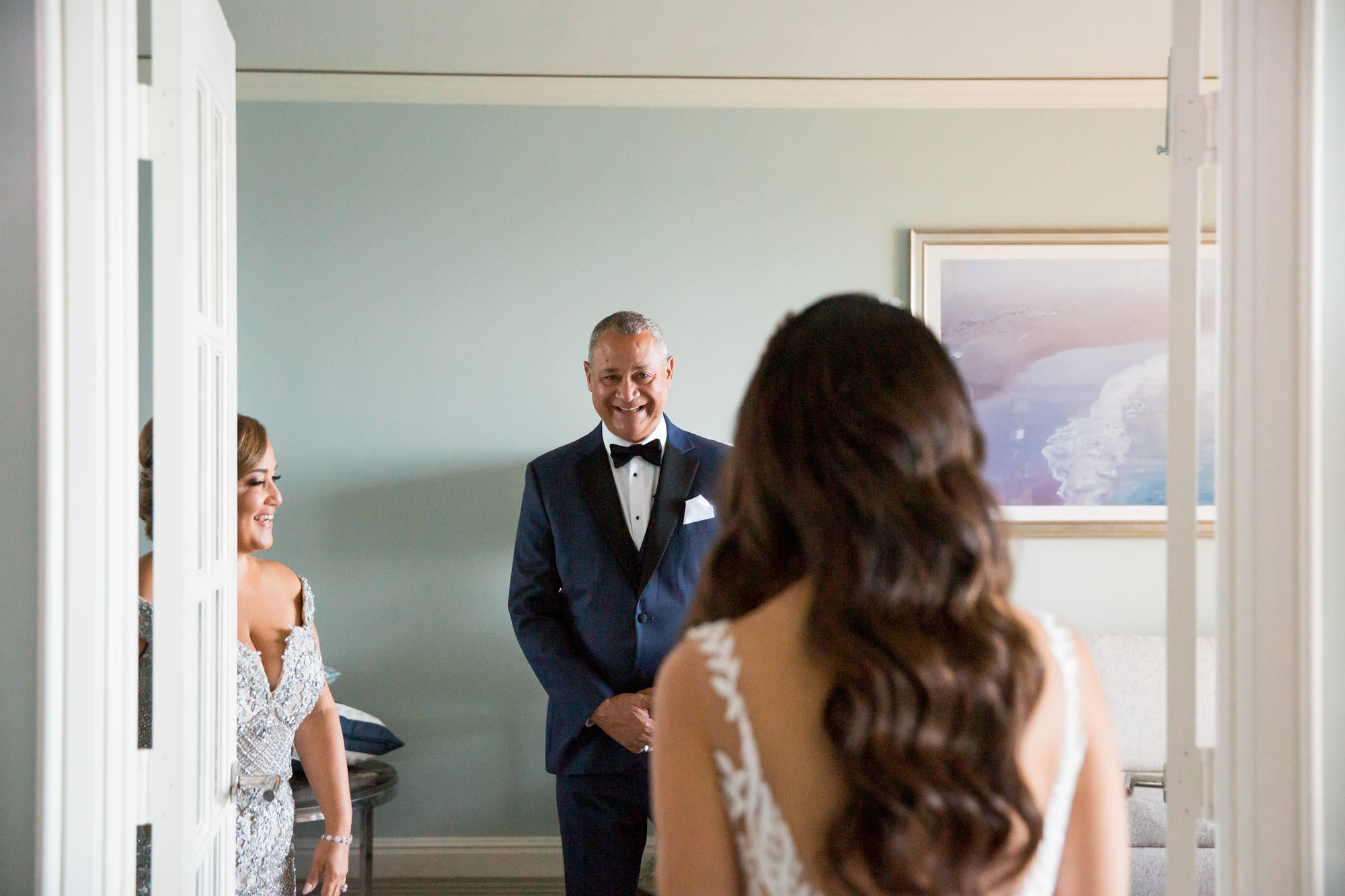 bride's Dad sees her in her wedding dress on her wedding day for the first time.