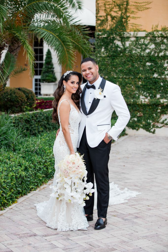 bride and groom pose for a portrait by their wedding photographer, Ambrosio Photography