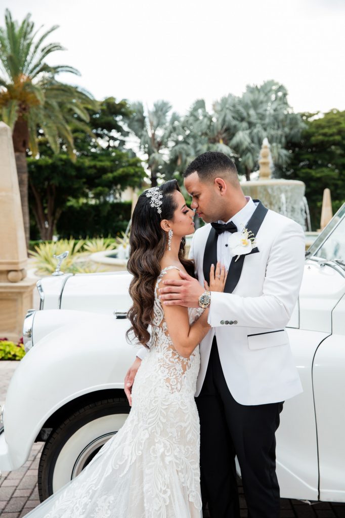 groom embraces bride during their wedding day portraits at the Ritz-Carlton, Key Biscayne