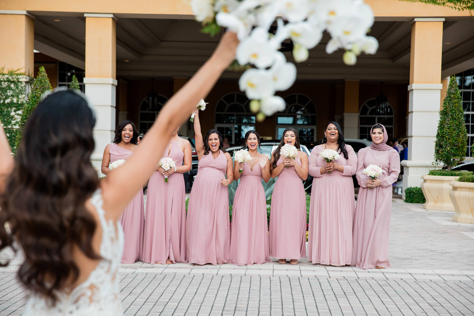bridesmaids react to seeing bride for the first time on her wedding day, by Miami Wedding Photographer Ambrosio Photography