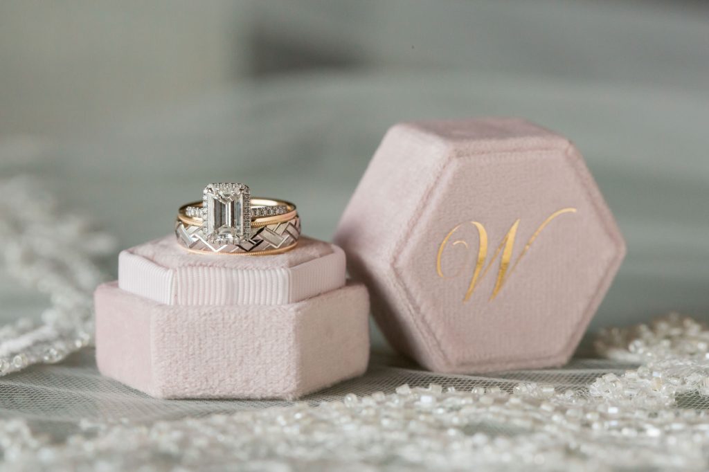 wedding ring on it's pastel pink box, by Ambrosio Photography