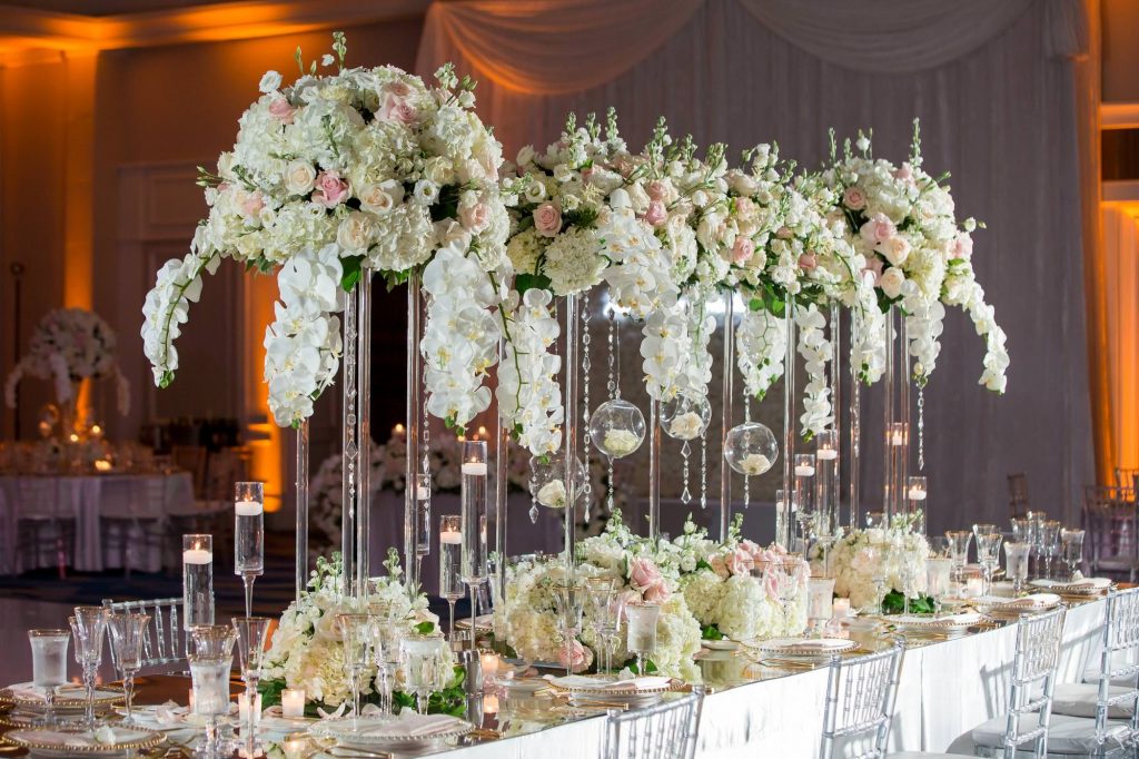 florals in blush and pink on the tables in the reception room