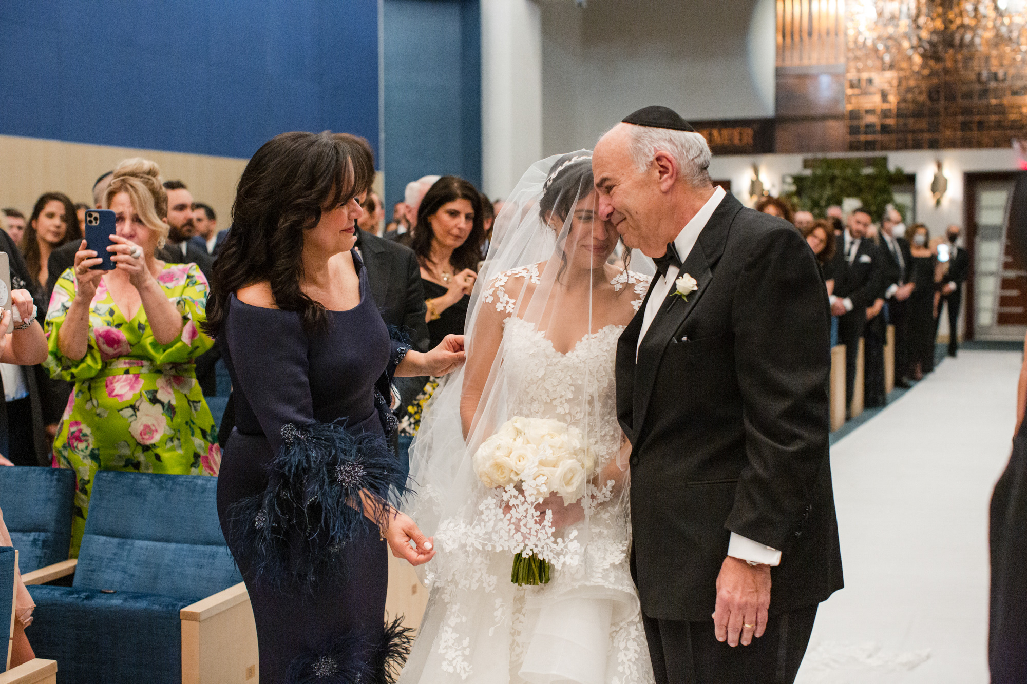 bride hugged by dad in the aisle of the Beth Torah Benny Rok Temple 