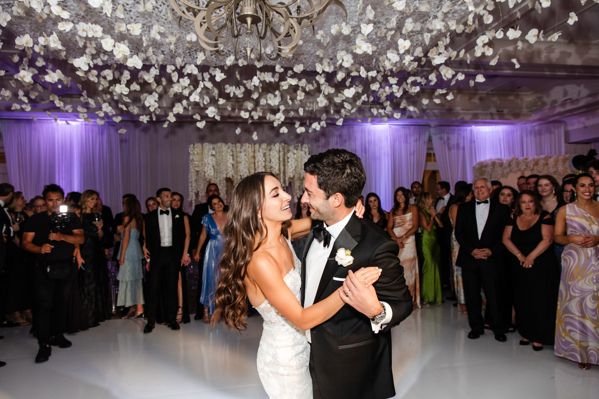 bride and groom on the dance floor for their first dance