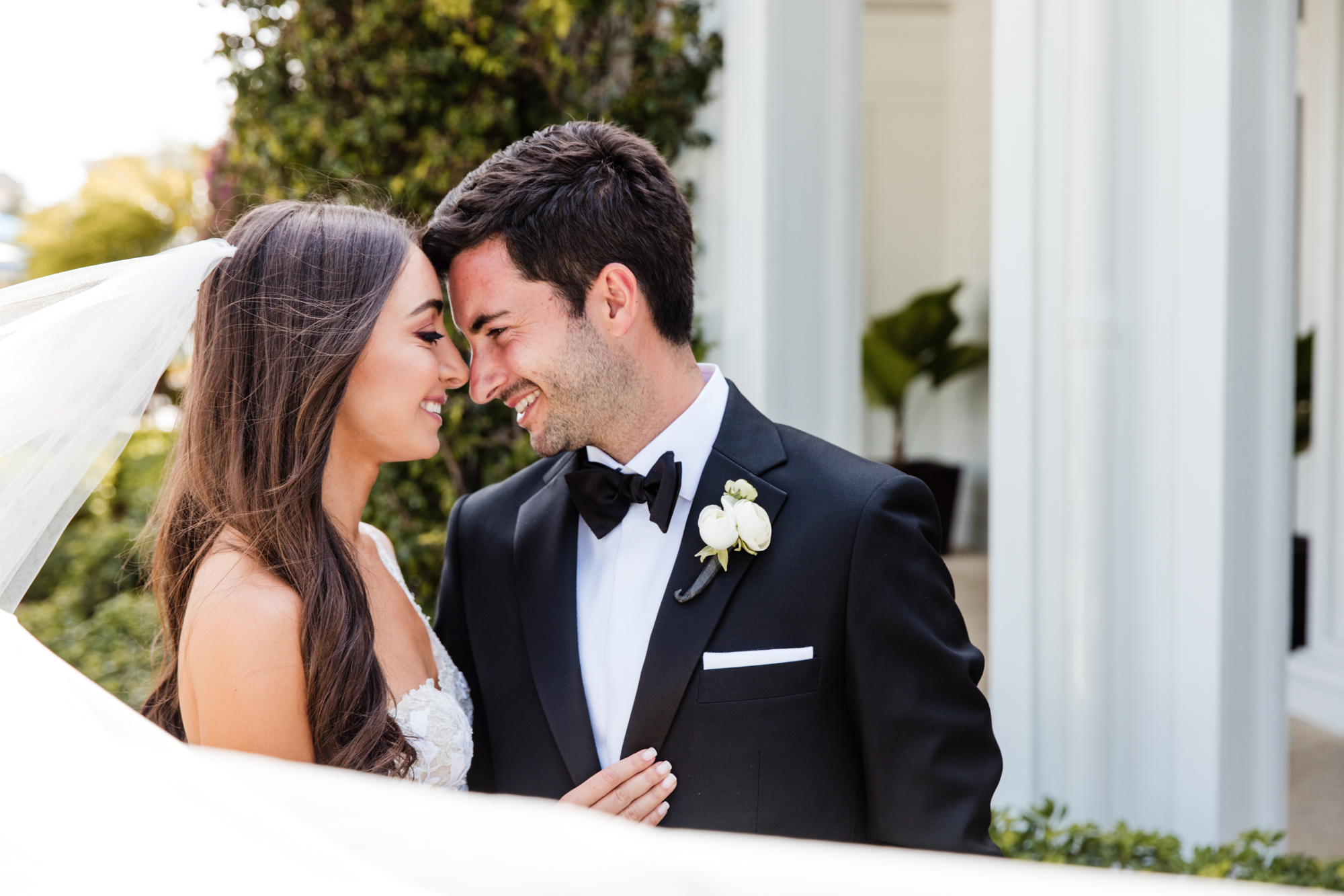 Bride and groom pose for portraits at Royal Palm Yacht Club in Boca Raton.