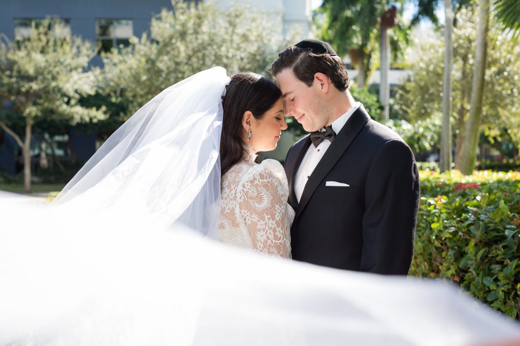 A formal bride and groom portrait during a wedding at the Aventura Chabbad in Aventura.