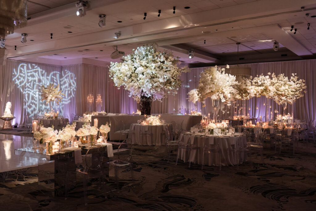 EWide shot of Polo Club reception space styled for elegant wedding dinner