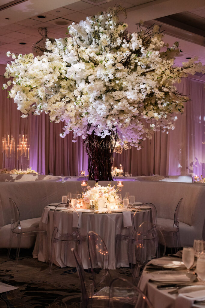Floral centerpiece arranged in low vessel on Polo Club reception table
