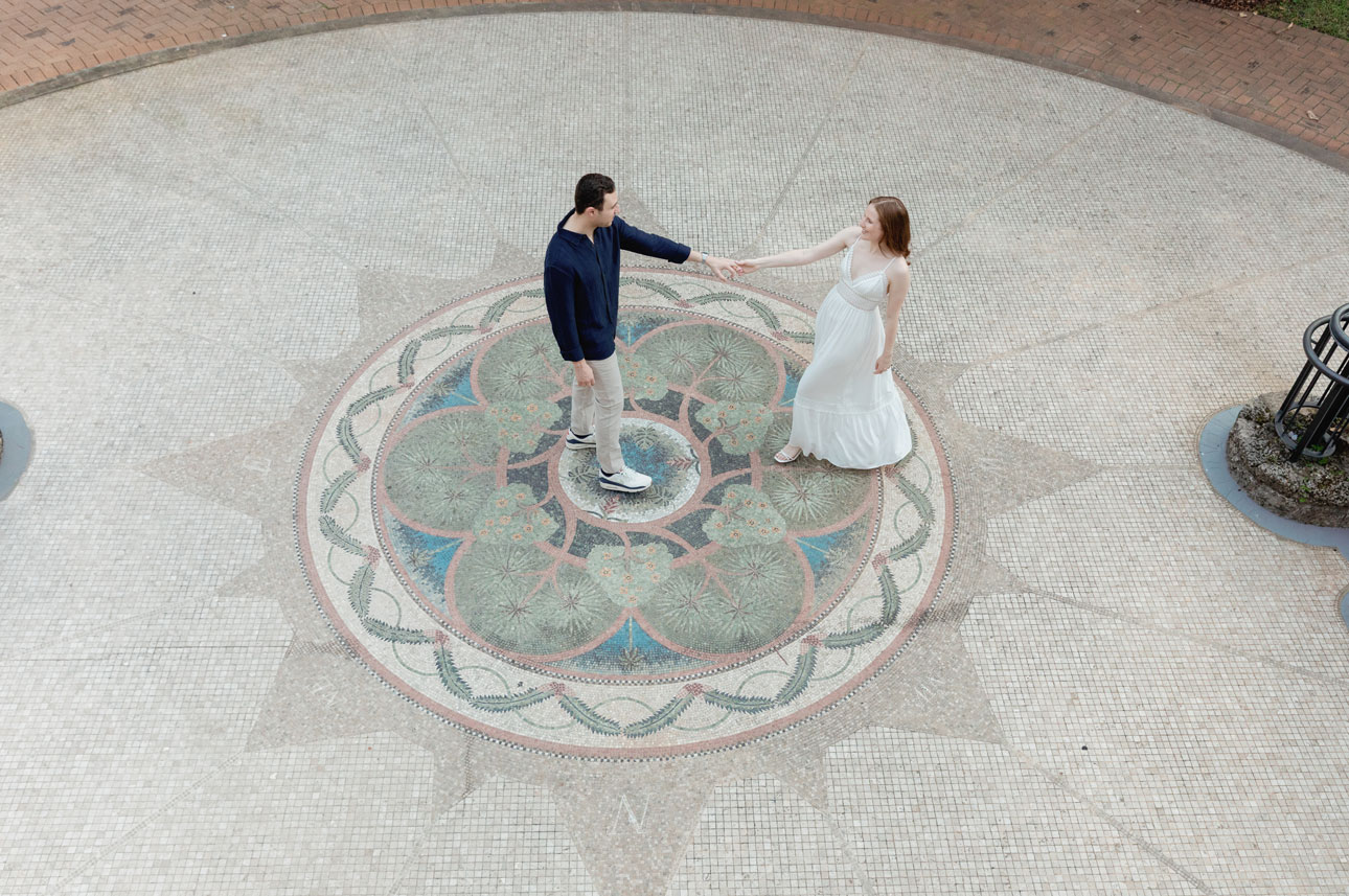 Engaged couple dancing through Fairchild Tropical Gardens during their enagement session.