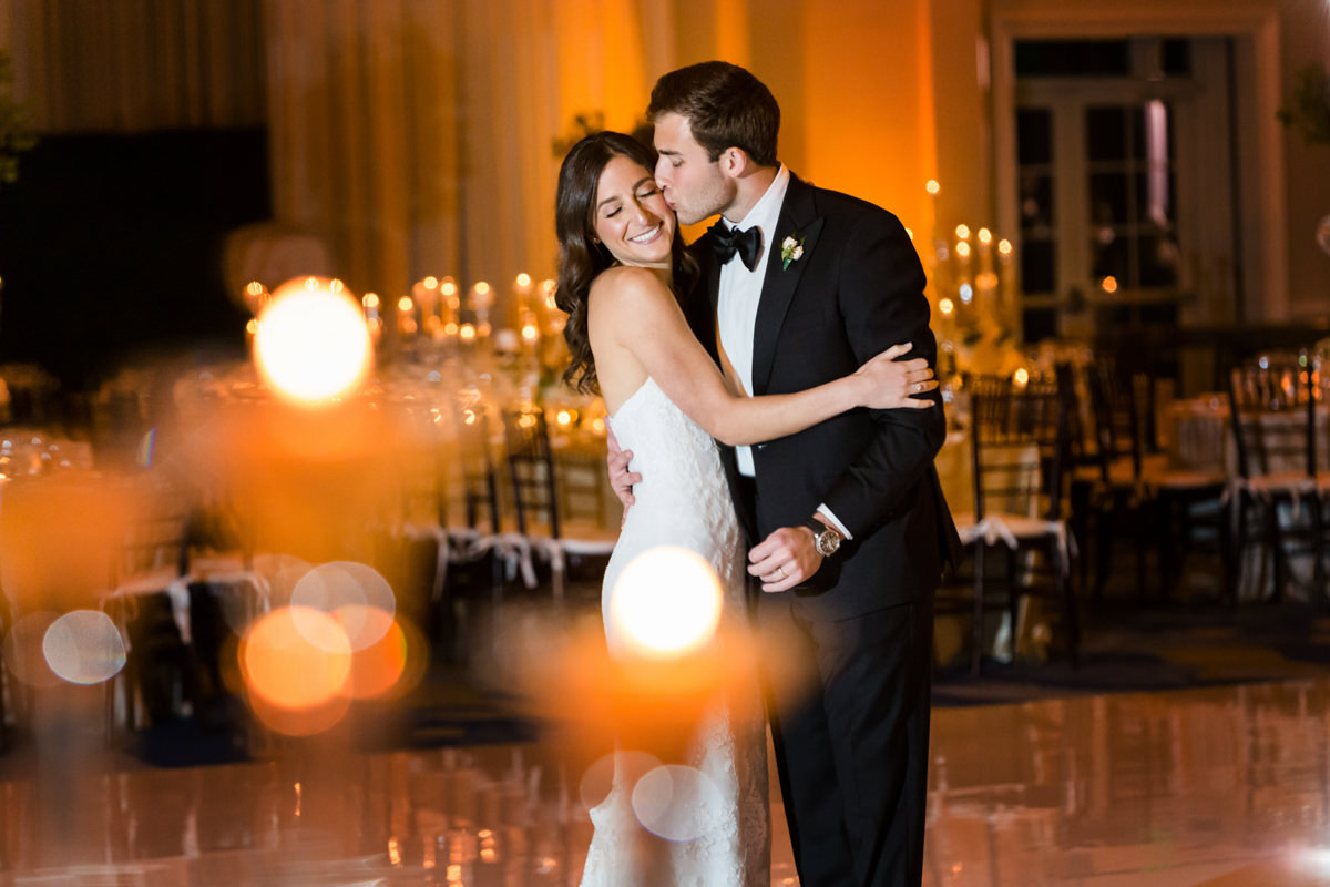 Bride and groom kissing in the ballroom n at the Ritz Carlton in Key Biscayne.