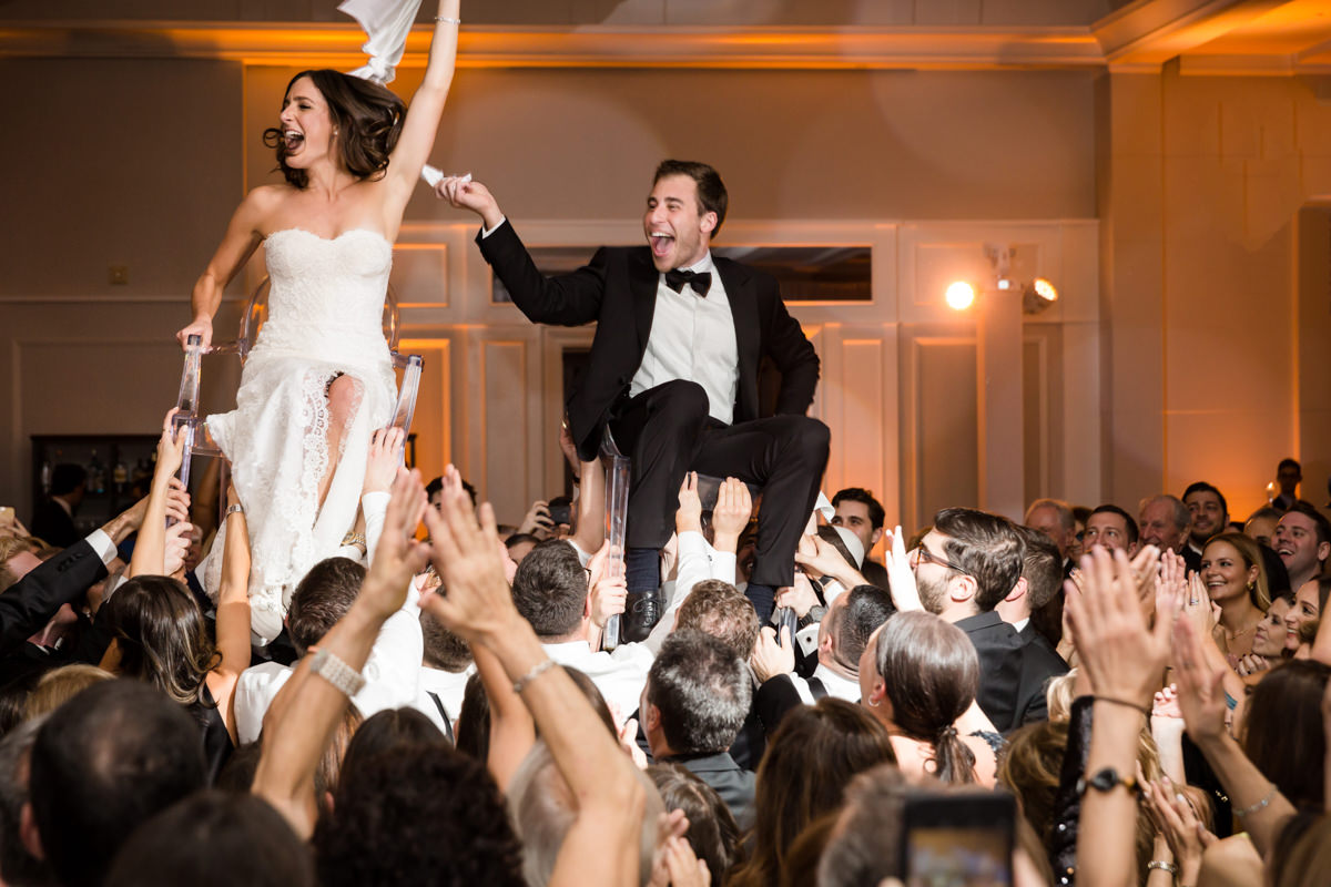 Couple doing the hora during their wedding at the Ritz Carlton in Key Biscayne.