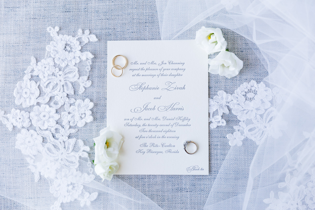 Wedding rings on a letterpress invitation at the Ritz Carlton on Key Biscayne.
