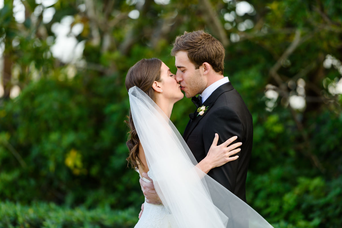 Bride and groom kissing at their wedding at the Ritz Carlton in Key Biscayne.