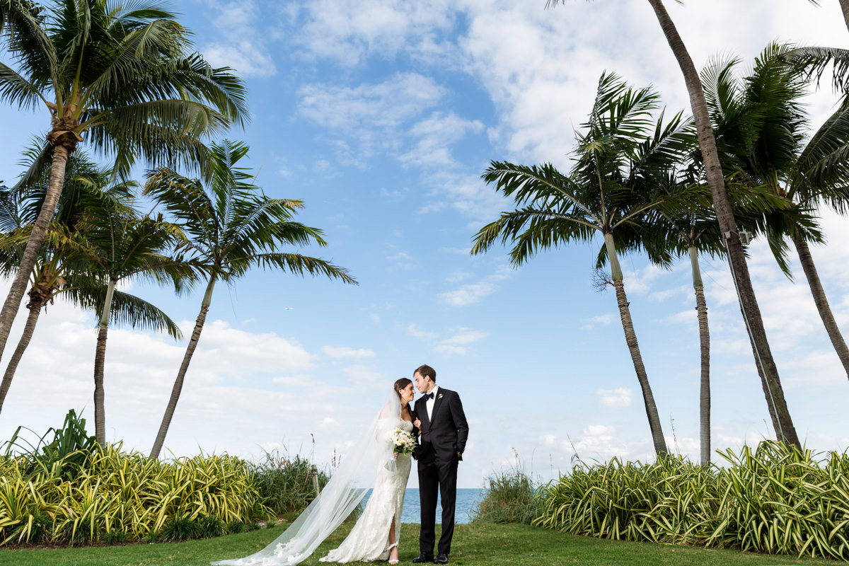 Bride and groom laughing during a wedding at the Ritz Carlton in Key Biscayne.