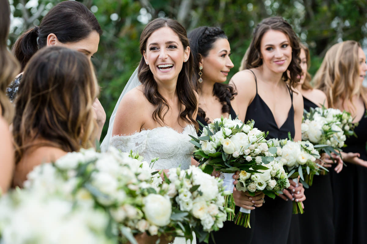 Bride laughing with her bridesmaids at the Ritz Carlton in Key Biscayne.