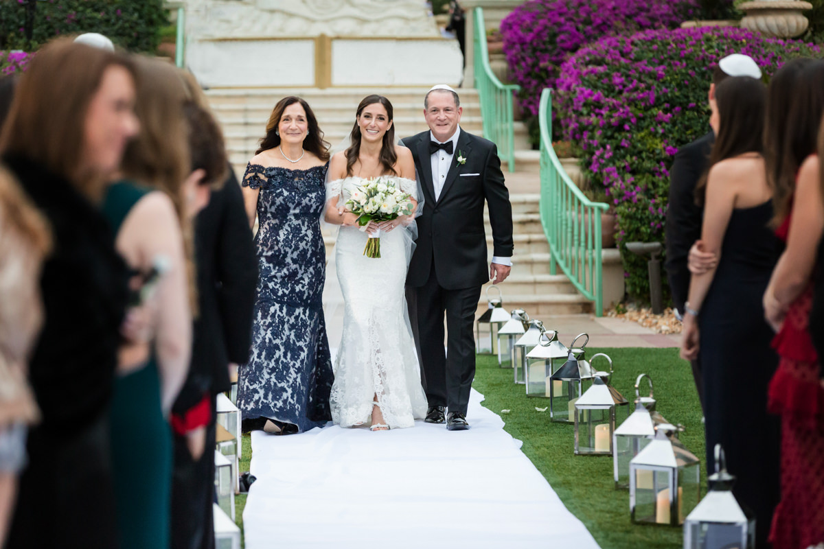Bride escorted by her parents at the Ritz Carlton in Key Biscayne.