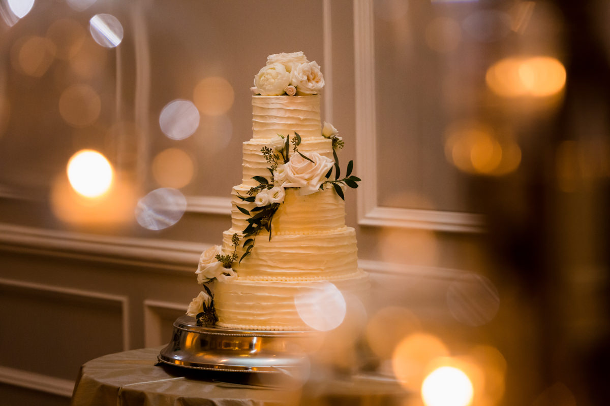 A white wedding cake adorned with flowers at the Ritz Carlton on Key Biscayne.