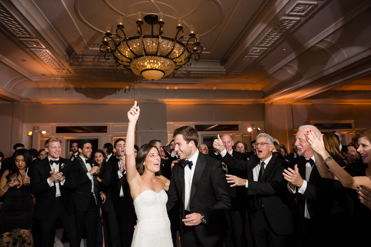 Bride and groom make an entrance into their wedding reception at the Ritz Carlton on Key Biscayne.
