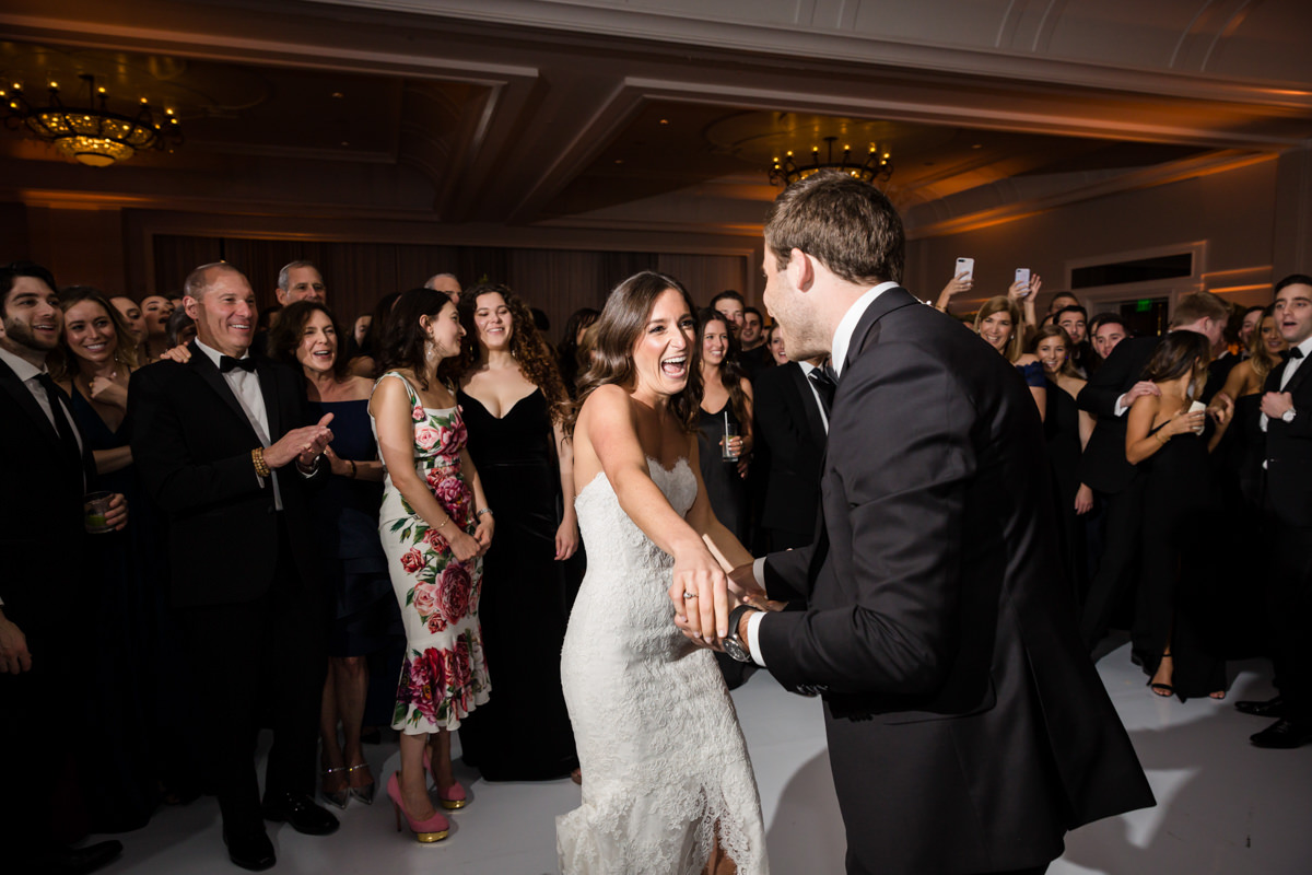 Bride and groom make an entrance into their wedding reception at the Ritz Carlton on Key Biscayne.