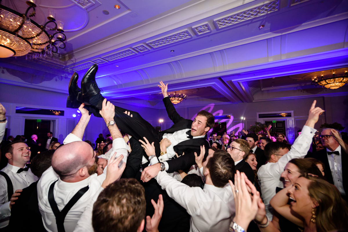 Groom crowd surfs in the ballroom at the Ritz Carlton in Key Biscayne.