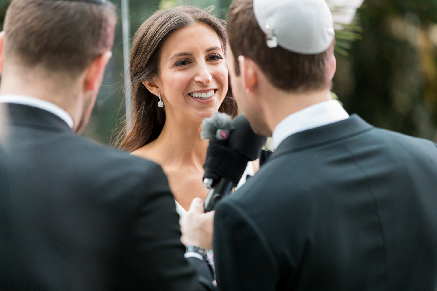 The exchange of wedding vows during a ceremony at the Miami Beach Edition.