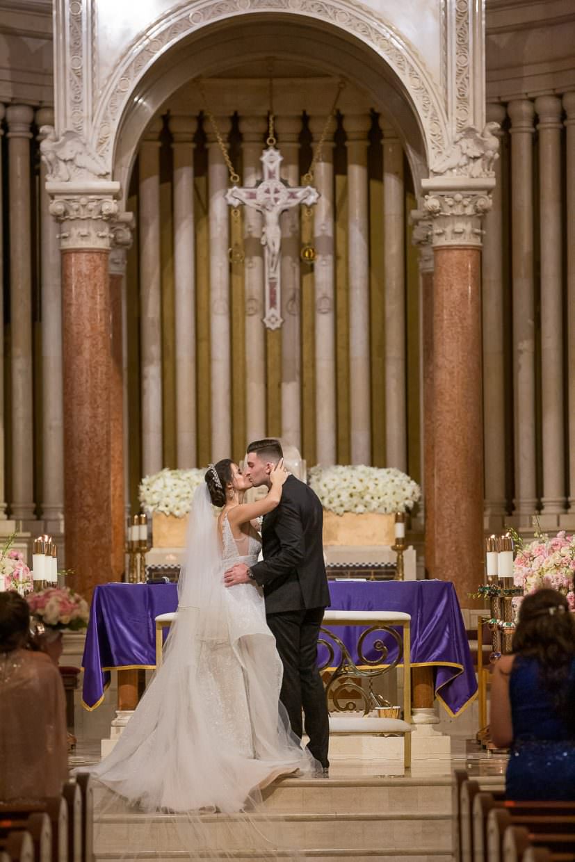 First kiss at the end of a wedding ceremony at St. Patrick's church in Miami Beach.