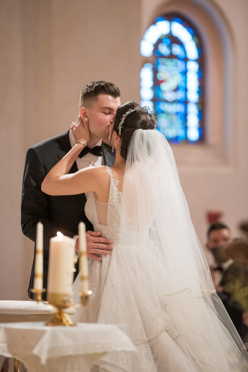 First kiss at the end of a wedding ceremony at St. Patrick's church in Miami Beach.