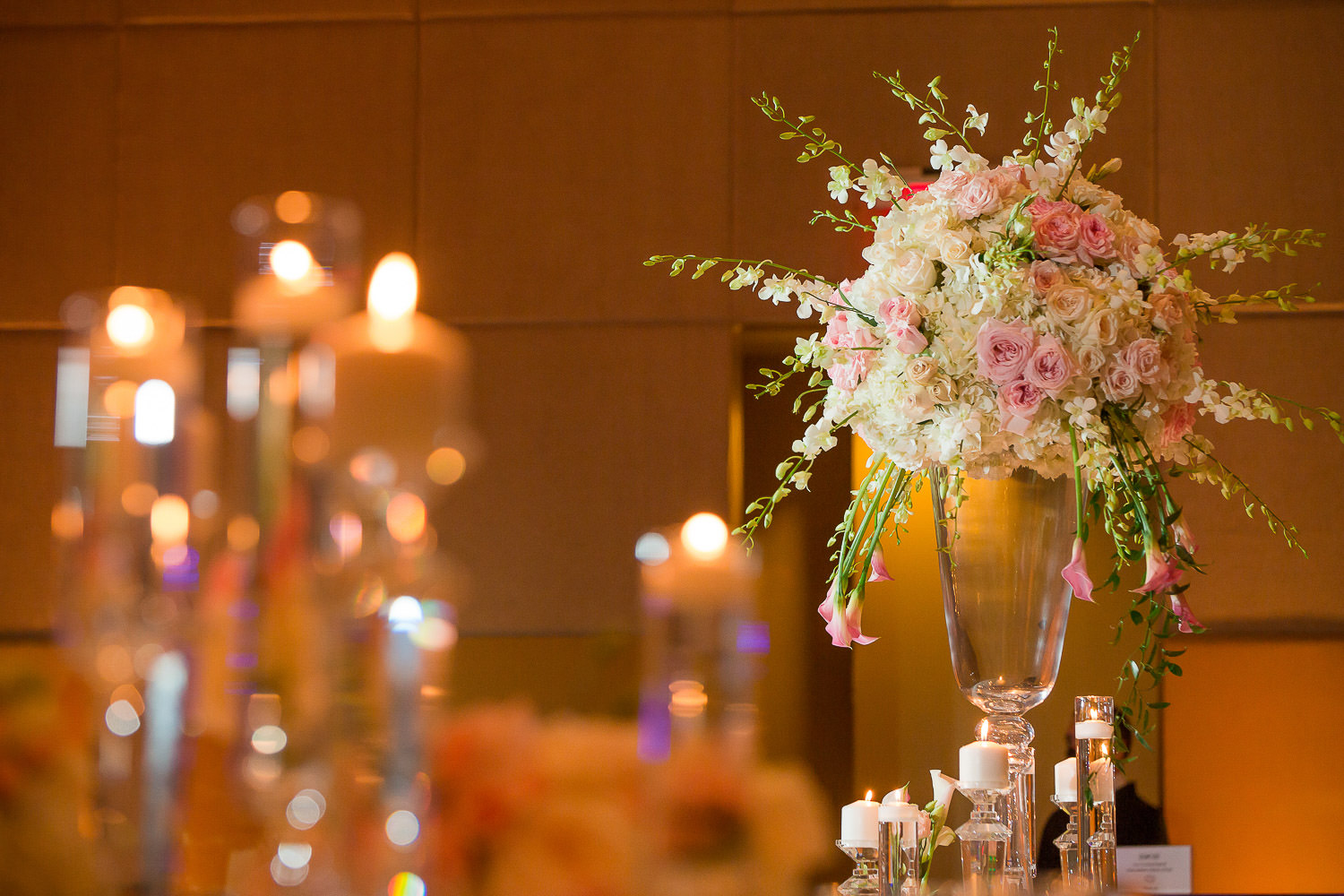 Candles and flowers on a table designed by Avante Gardens at the Mandarin Oriental in Miami.