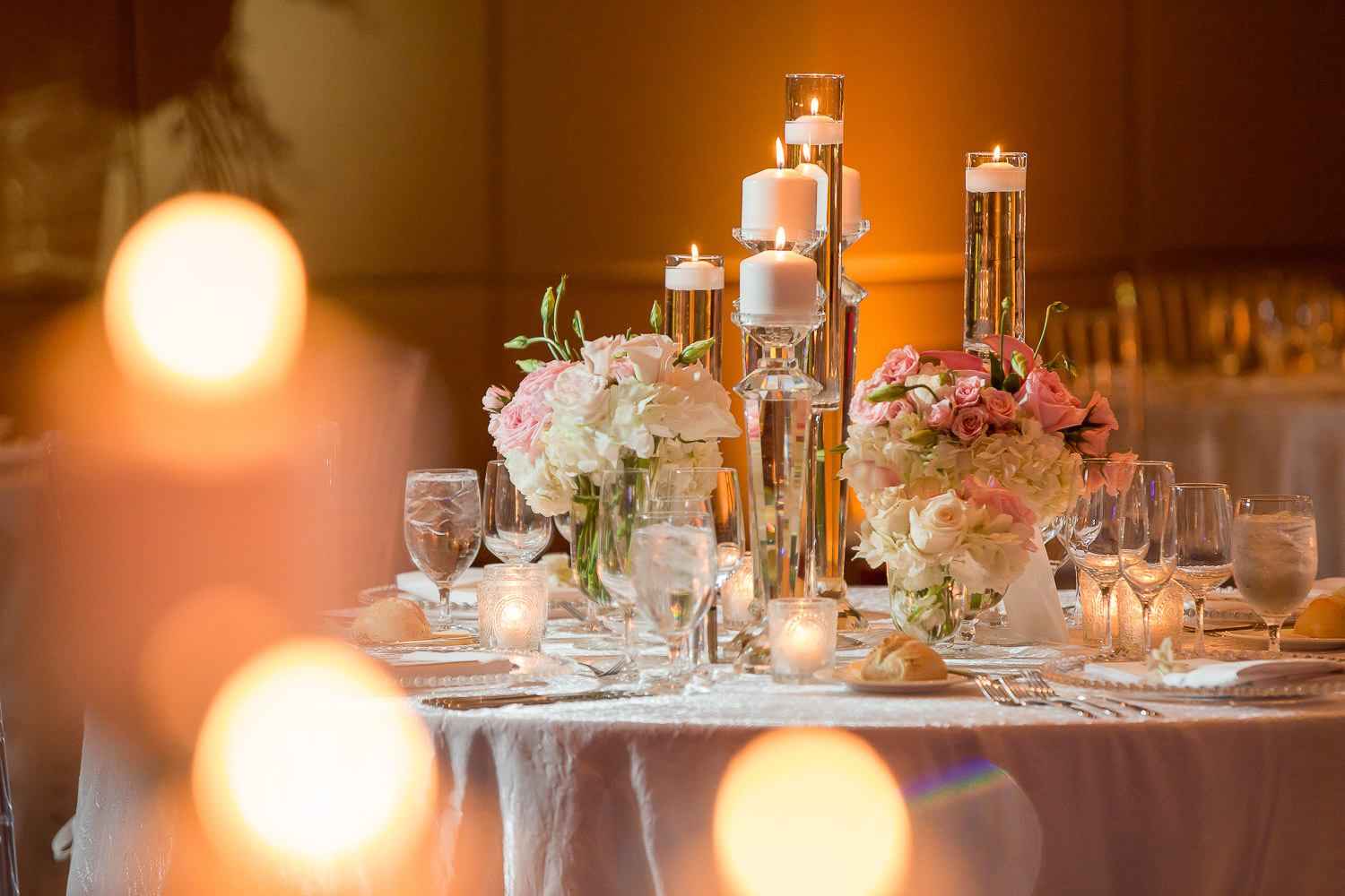 Candles and flowers on a table designed by Avante Gardens at the Mandarin Oriental in Miami.
