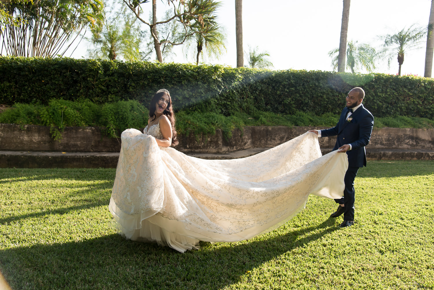 Bride and groom walking toward the courtyard at the Biltmore Hotel on their wedding day.