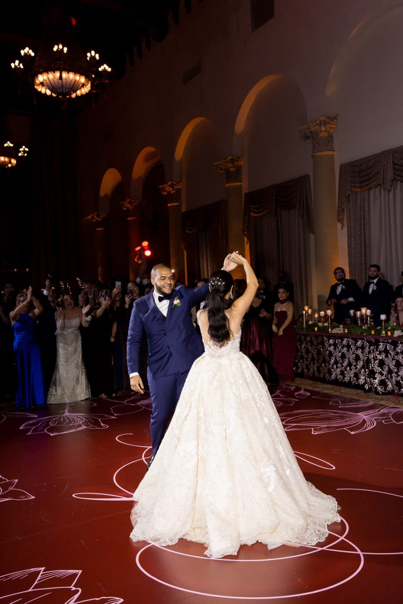 Bride and groom share a first dance in the country club ballroom at the Biltmore Hotel in Miami.