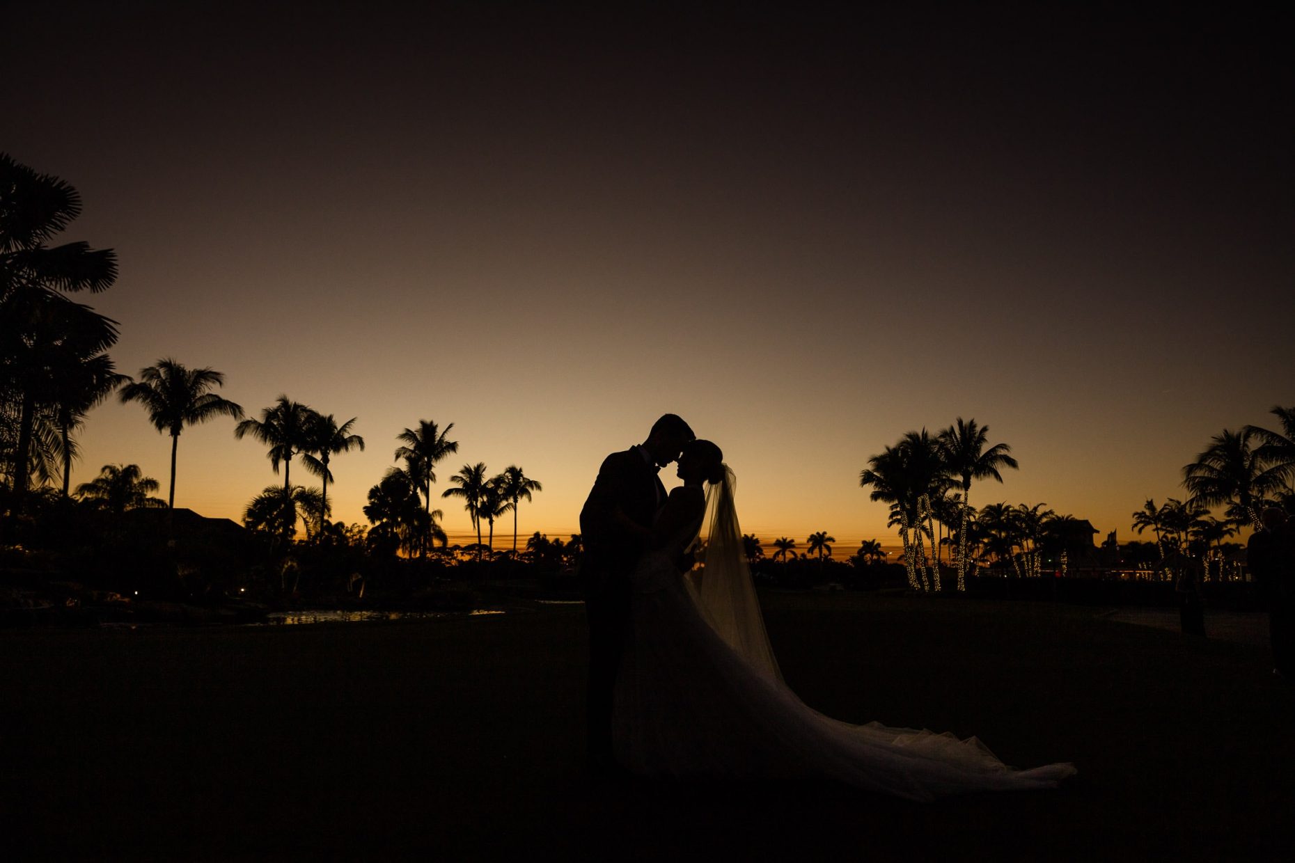 A sunset portrait of a bride and groom at the Polo Club in Boca Raton.