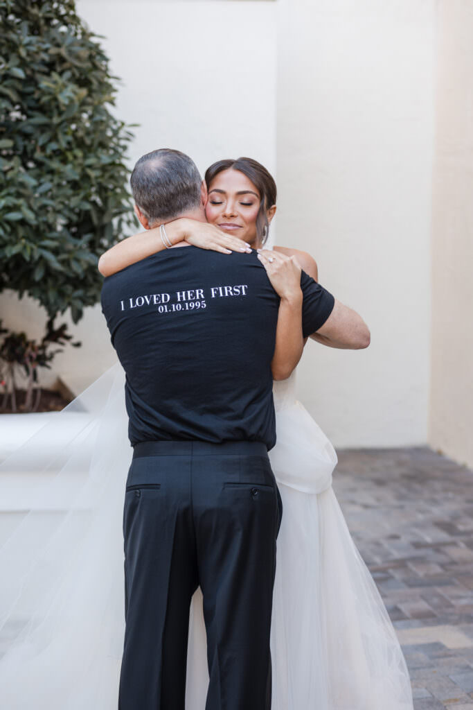 Emotional first look between bride and her dad on lush Polo Club grounds