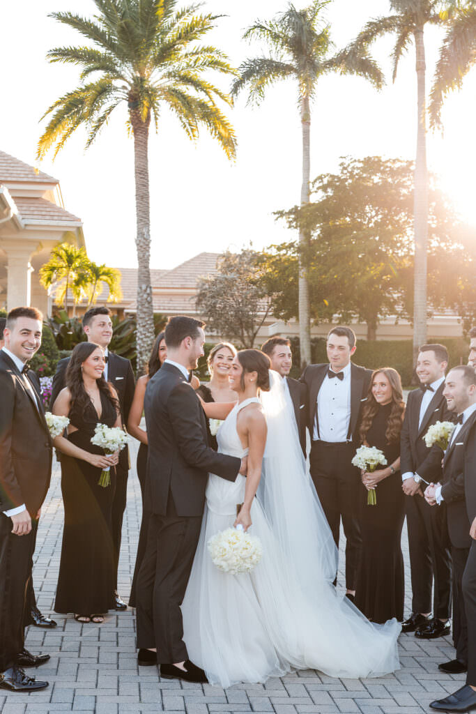 Bridesmaids and groomsmen candid moment before ceremony at The Polo Club