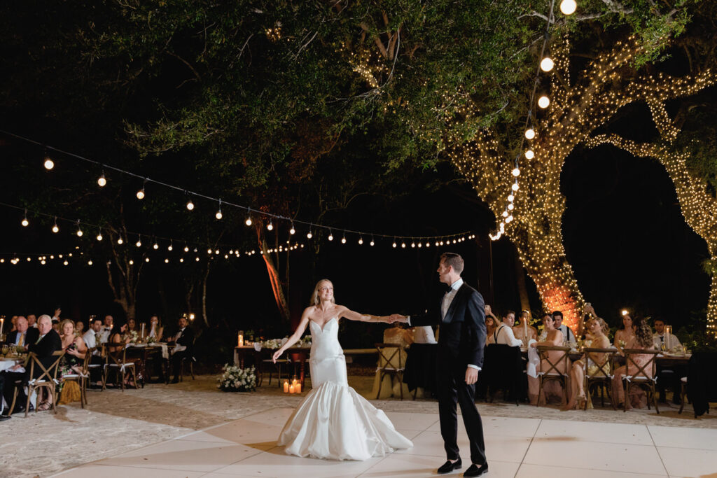 Bride and groom celebrating with their guests at the Deering Estate reception