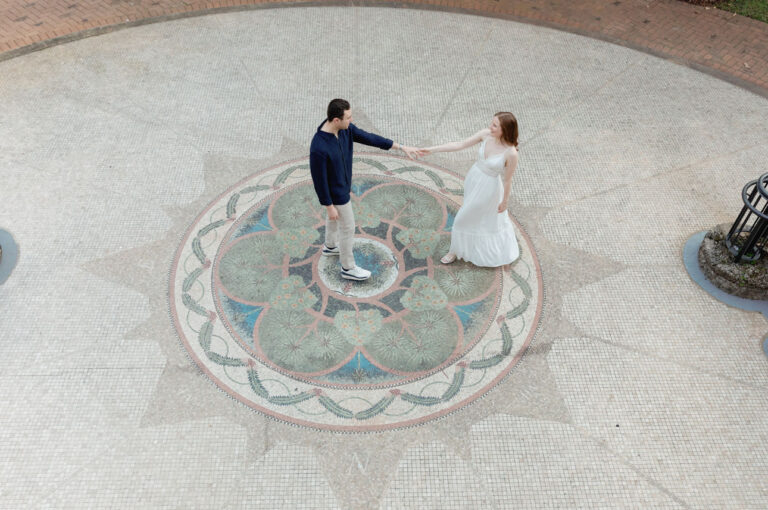 Engaged couple dancing through Fairchild Tropical Gardens during their enagement session.
