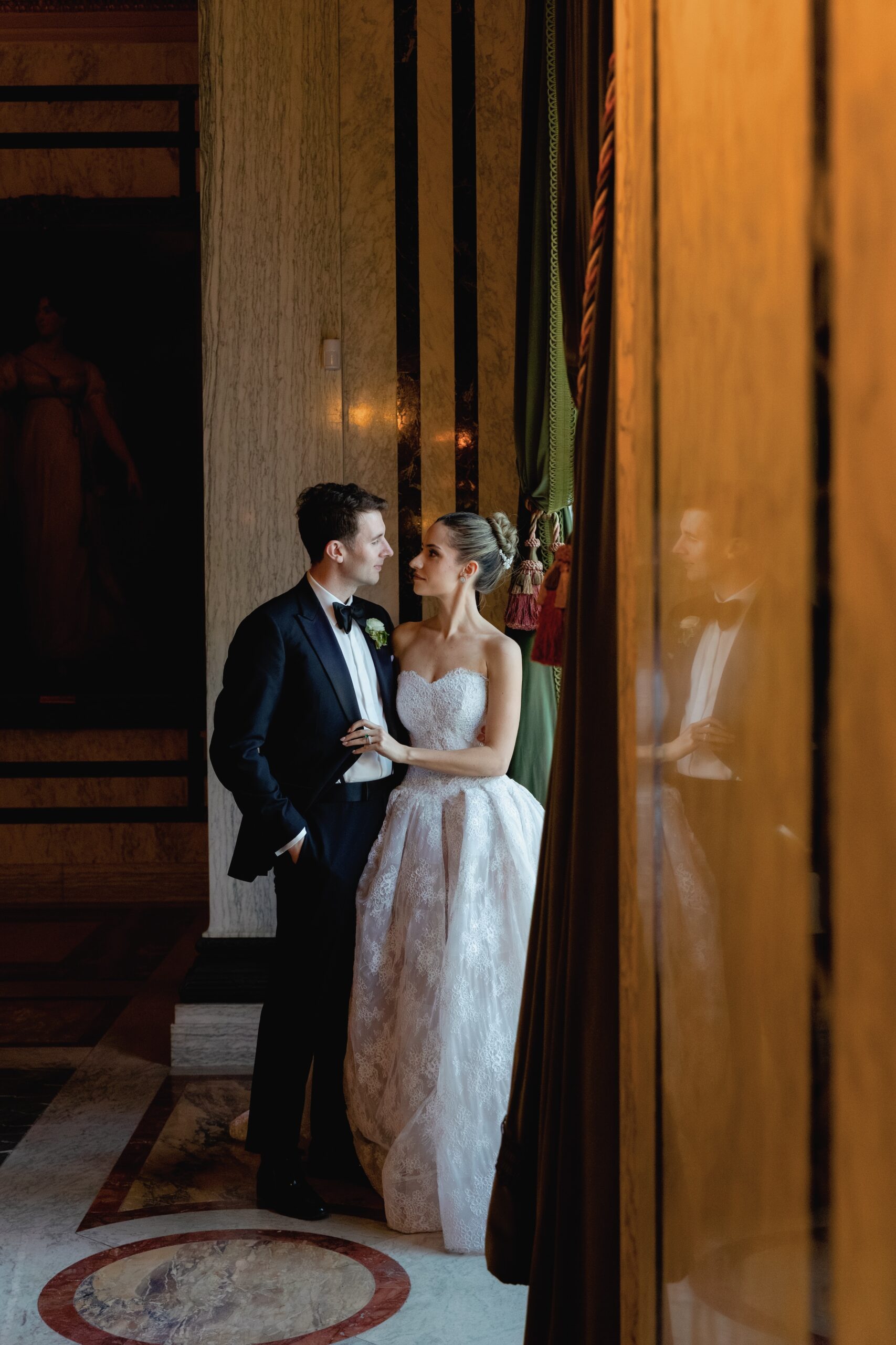 Bride and Groom Embrace During Flagler Museum Palm Beach Wedding