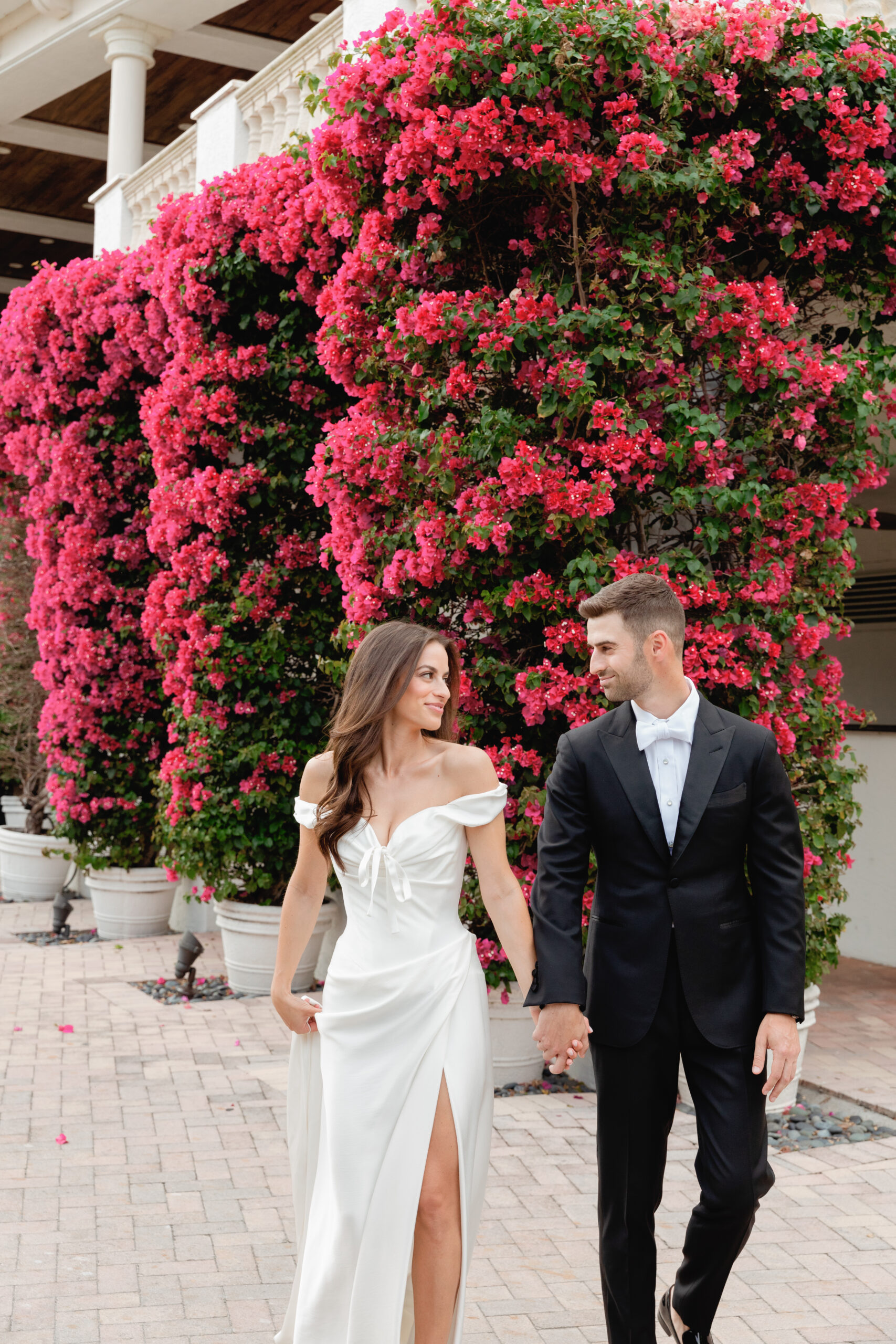 Newlywed Couple Walking and Holding Hands at Addison Reserve Country Club