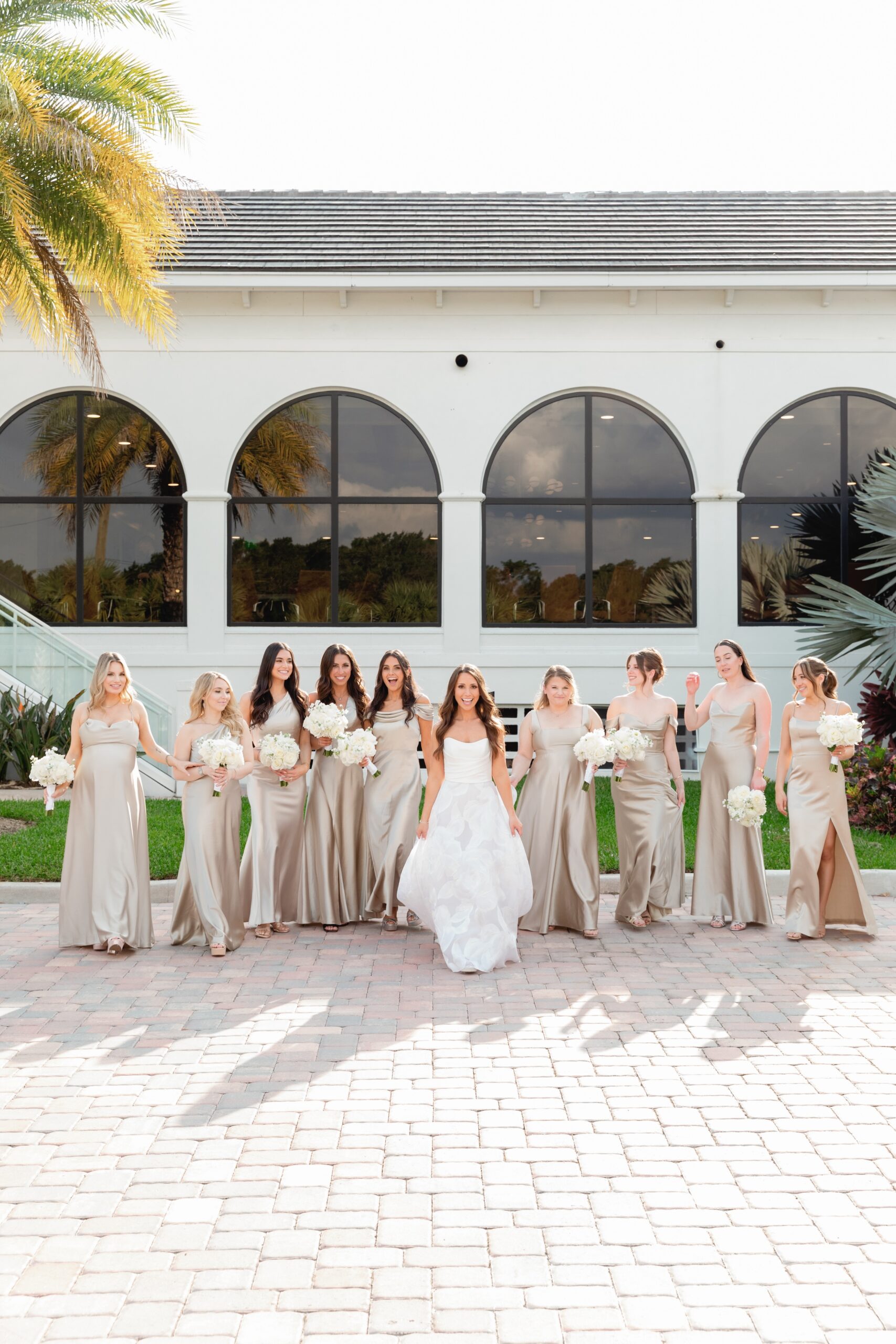 Bride and Bridesmaids Walking Toward Ceremony at Broken Sound Club