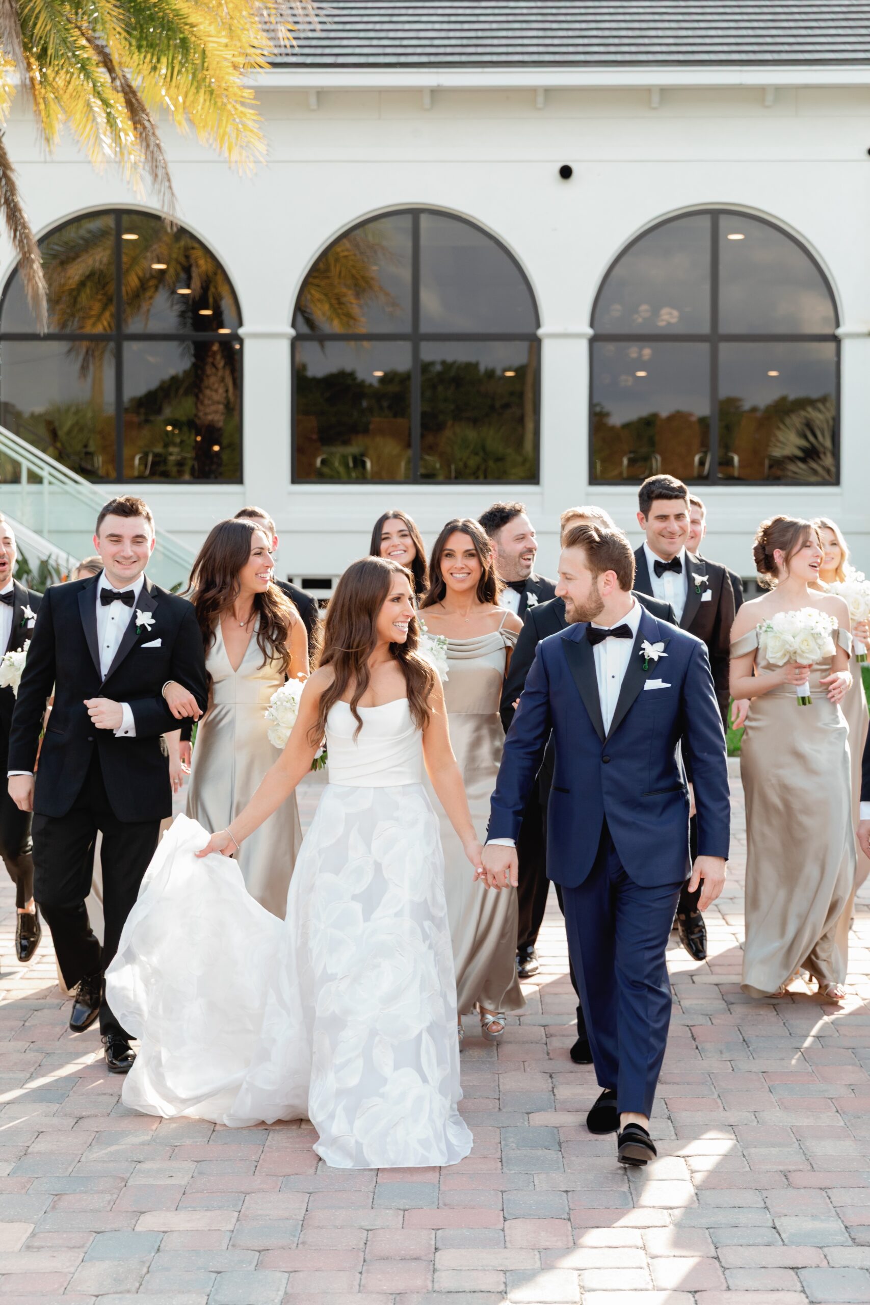 Bride and Groom and Wedding Party Walking to Wedding at Broken Sound Club